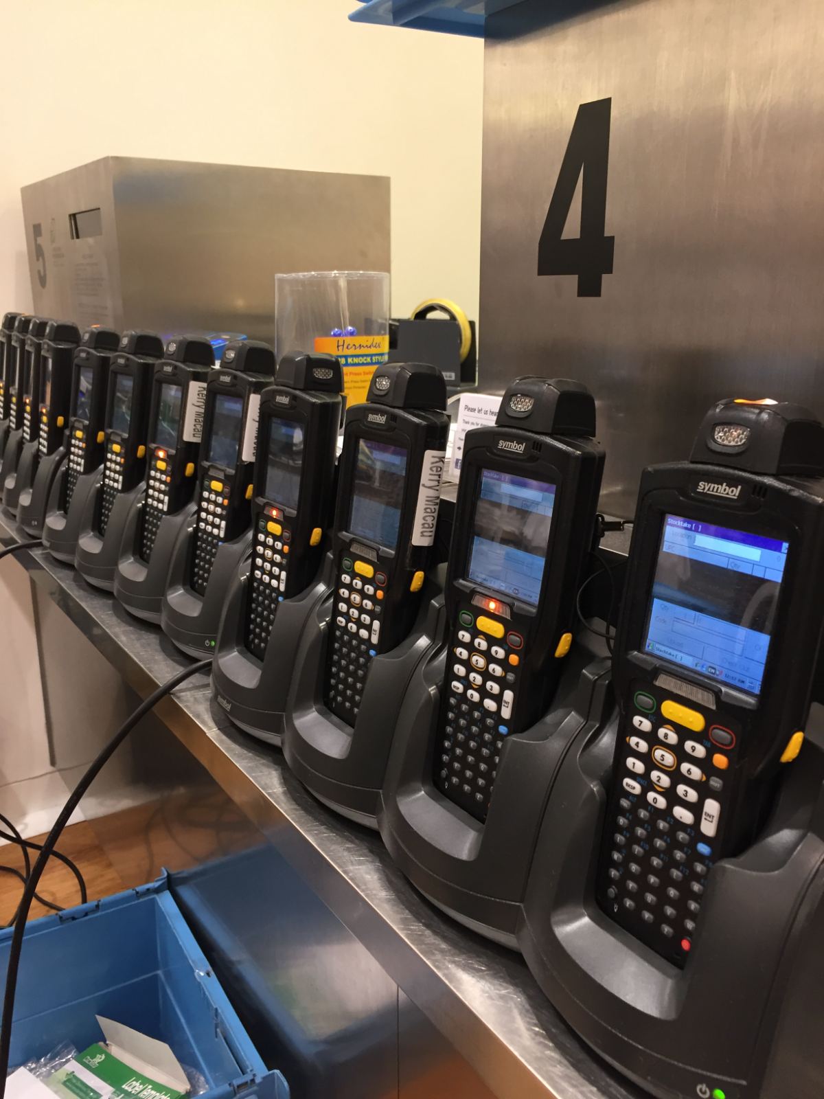 Handheld barcode scanner fleet in charging docks for a Hong Kong stocktake